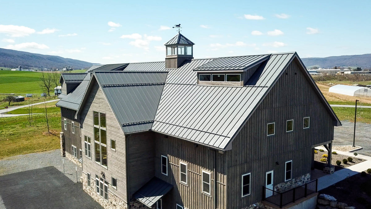 Snow retention system installed on a commercial metal roof