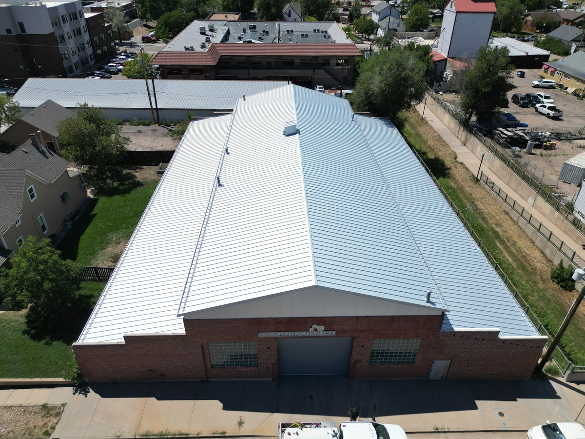 Snow retention system installed on a commercial metal roof